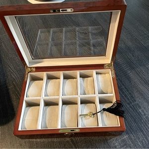 Beautiful watch case with key to lock. Holds 10 watches 12x 8 3/4 x 3 1/2